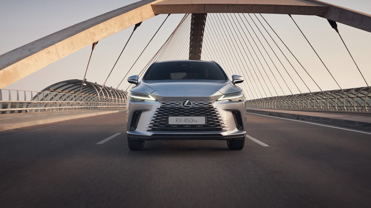 A Lexus RX driving on a road