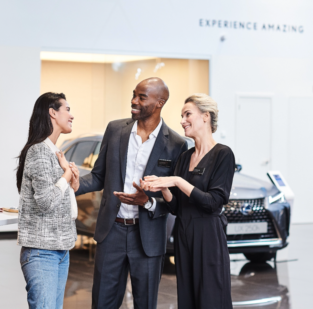 Lexus dealership talking with a customer