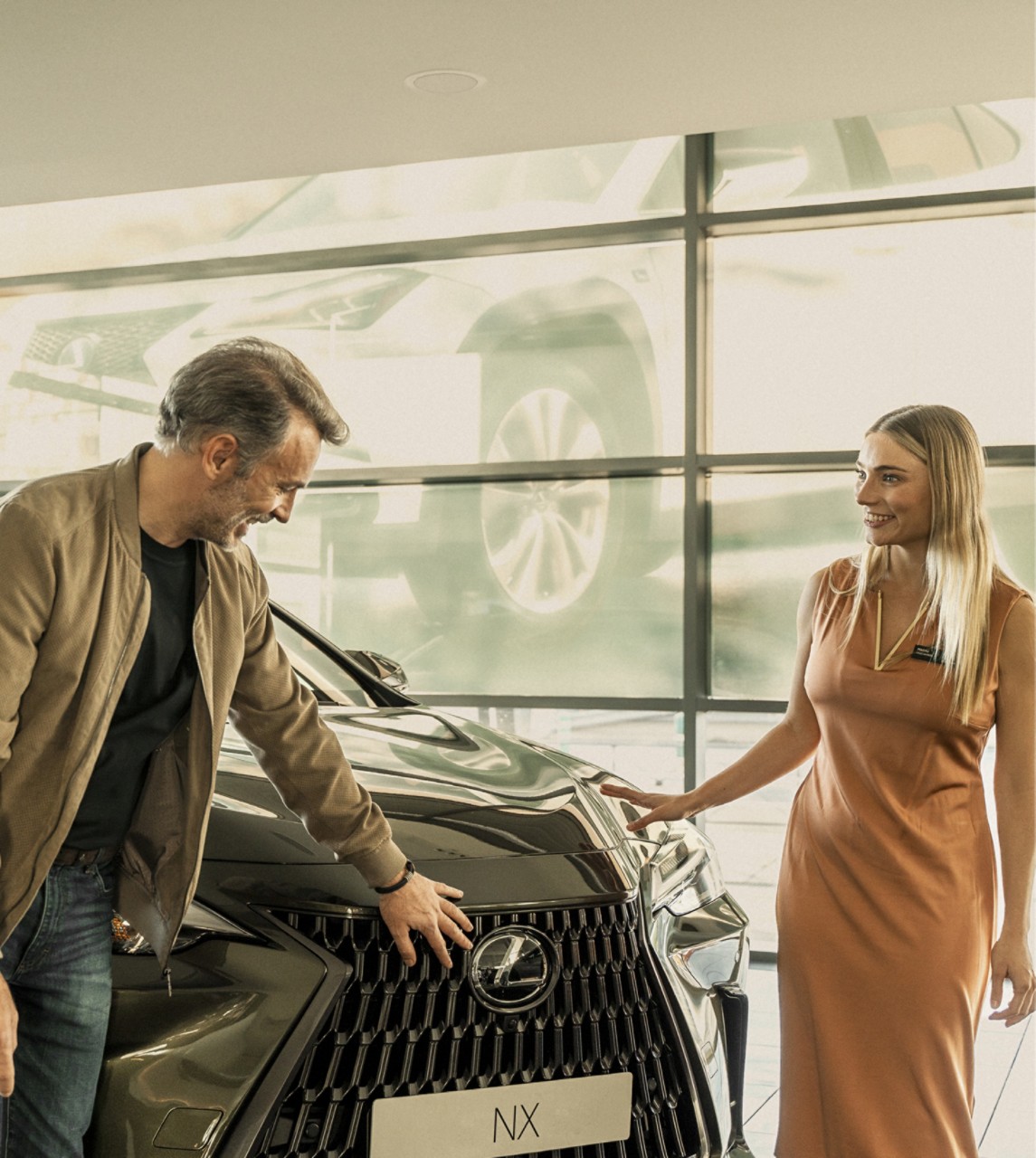 Man looking at Lexus NX at Lexus Centre